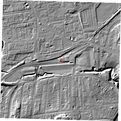 Shaded relief map of the ground around YO153EP, computed from Environment Agency LiDAR. The ground here sits at about 11 m above sea level and falls 12 m across the surrounding 800 m. Surface water reaching this point runs off ground lying to the south, 9.6 m higher.