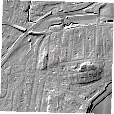 Shaded relief map of the ground around YO153HQ, computed from Environment Agency LiDAR. The ground here sits at about 12 m above sea level and falls 15 m across the surrounding 800 m. Surface water reaching this point runs off ground lying to the west-south-west, 1.0 m higher.