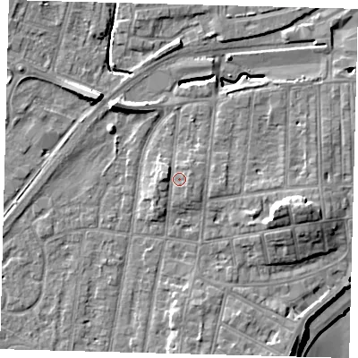 Shaded relief map of the ground around YO153PF, computed from Environment Agency LiDAR. The ground here sits at about 12 m above sea level and falls 14 m across the surrounding 800 m. Surface water reaching this point runs off ground lying to the east, 1.0 m higher.