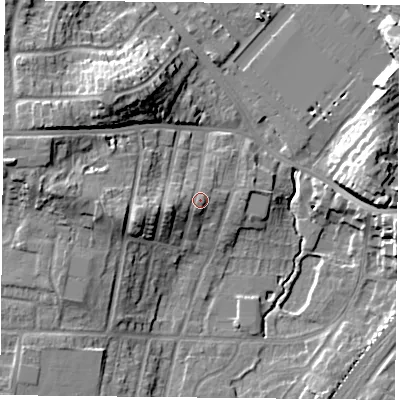 Shaded relief map of the ground around YO244JG, computed from Environment Agency LiDAR. The ground here sits at about 15 m above sea level and falls 18 m across the surrounding 800 m. Surface water reaching this point runs off ground lying to the west, 0.9 m higher.