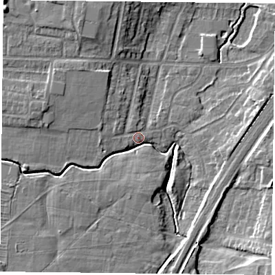 Shaded relief map of the ground around YO244JU, computed from Environment Agency LiDAR. The ground here sits at about 13 m above sea level and falls 10 m across the surrounding 800 m. Surface water reaching this point runs off ground lying to the north-west, 5.8 m higher.