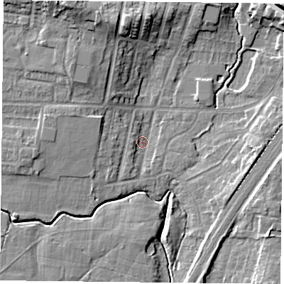 Shaded relief map of the ground around YO244JY, computed from Environment Agency LiDAR. The ground here sits at about 11 m above sea level and falls 14 m across the surrounding 800 m. Surface water reaching this point runs off ground lying to the west-north-west, 5.7 m higher.