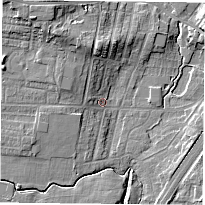Shaded relief map of the ground around YO244LD, computed from Environment Agency LiDAR. The ground here sits at about 12 m above sea level and falls 16 m across the surrounding 800 m. Surface water reaching this point runs off ground lying to the north-north-west, 10.4 m higher.