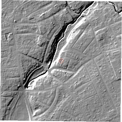 Shaded relief map of the ground around YO310RE, computed from Environment Agency LiDAR. The ground here sits at about 12 m above sea level and falls 8 m across the surrounding 800 m. Surface water reaching this point runs off ground lying to the east, 1.0 m higher.