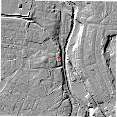 Shaded relief map of the ground around YO318JH, computed from Environment Agency LiDAR. The ground here sits at about 12 m above sea level and falls 9 m across the surrounding 800 m. Surface water reaching this point runs off ground lying to the west, 1.5 m higher.
