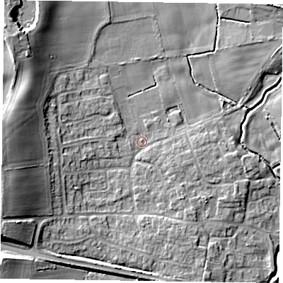 Shaded relief map of the ground around YO415ND, computed from Environment Agency LiDAR. The ground here sits at about 11 m above sea level and falls 15 m across the surrounding 800 m. Surface water reaching this point runs off ground lying to the west, 12.2 m higher.